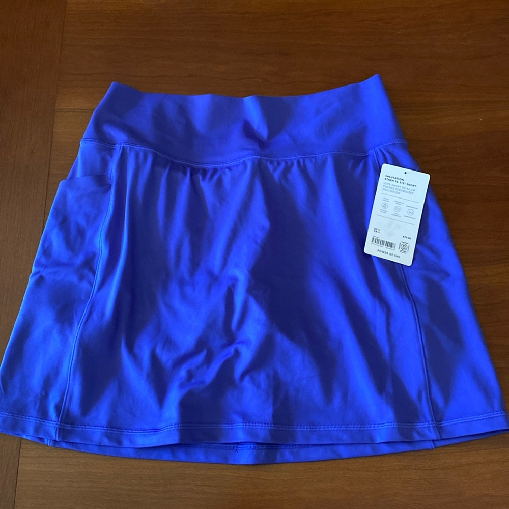 Athleta salutation stash skort. Size M. Lazurite Blue. 16 1/2” length.